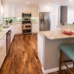 Kitchen with granite counters and wood floors