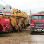 Mack Truck parked with cranes