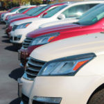Cars in a line in car lot